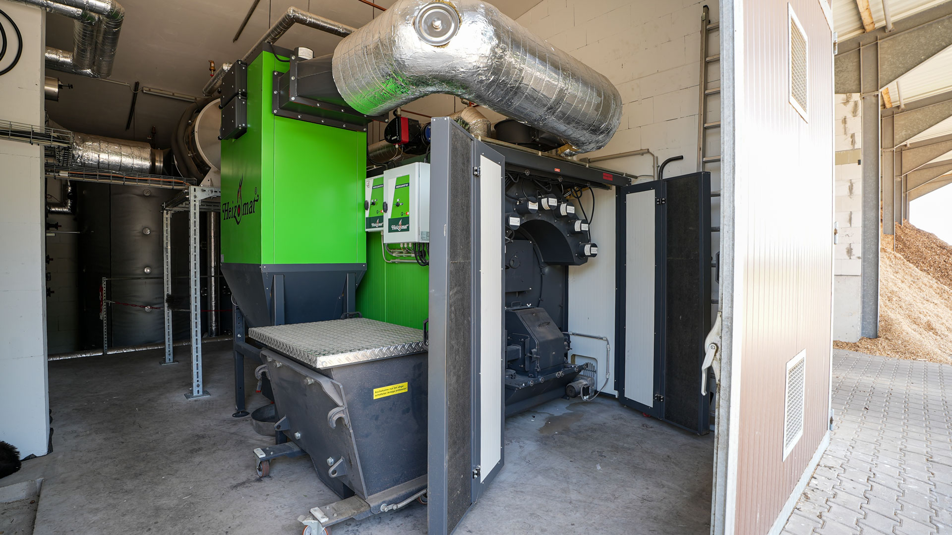 heizomat-prozesswärme-400-kw Heizomat 400 kW Hackschnitzelheizung mit Multizyklon, Partikelabscheider und Abgaswärmetasucher